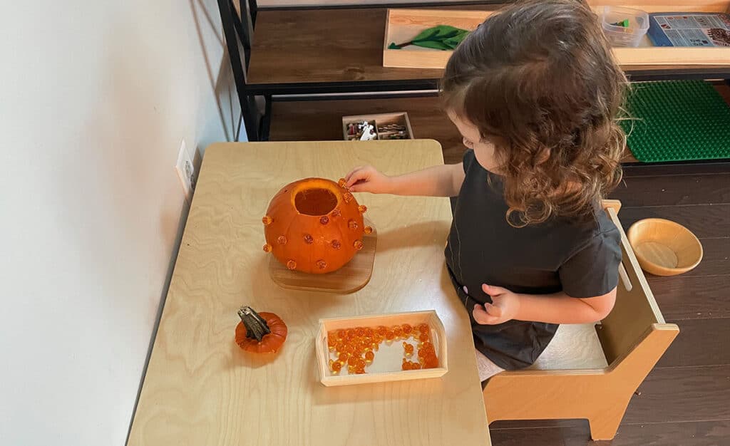 Montessori fall activities, hammering a pumpkin, halloween, homeschooling, practical life, preschoolers
