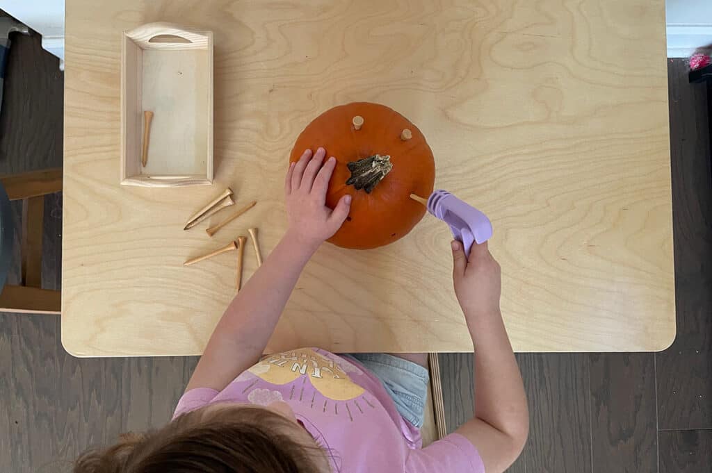 Montessori fall activities, hammering a pumpkin, halloween, homeschooling, practical life, preschoolers